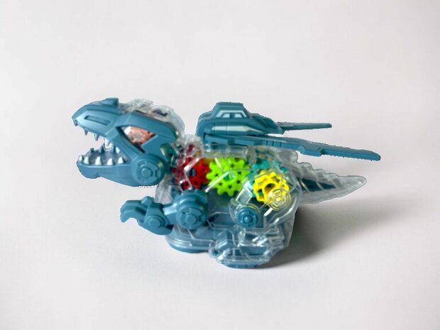 Dinosaurierspielzeug. Elektrisch transparent. Farbige Zahnr&auml;der mit Musik und Beleuchtung, 22,5 cm.